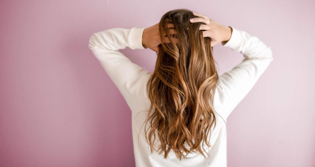 Woman holding her hair