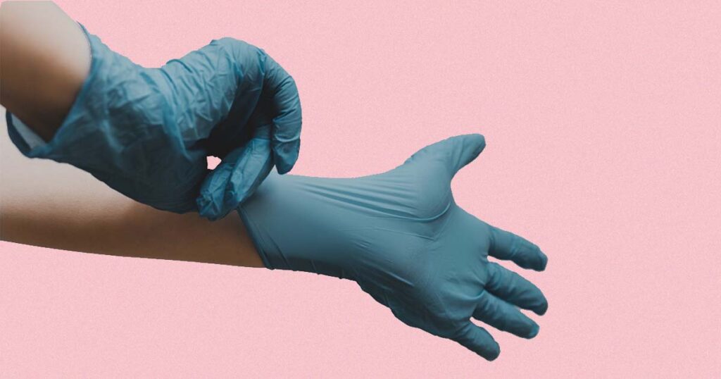 Blue Gloves on Pink Background