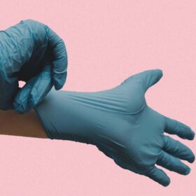 Blue Gloves on Pink Background