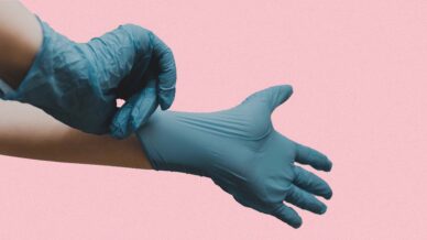 Blue Gloves on Pink Background