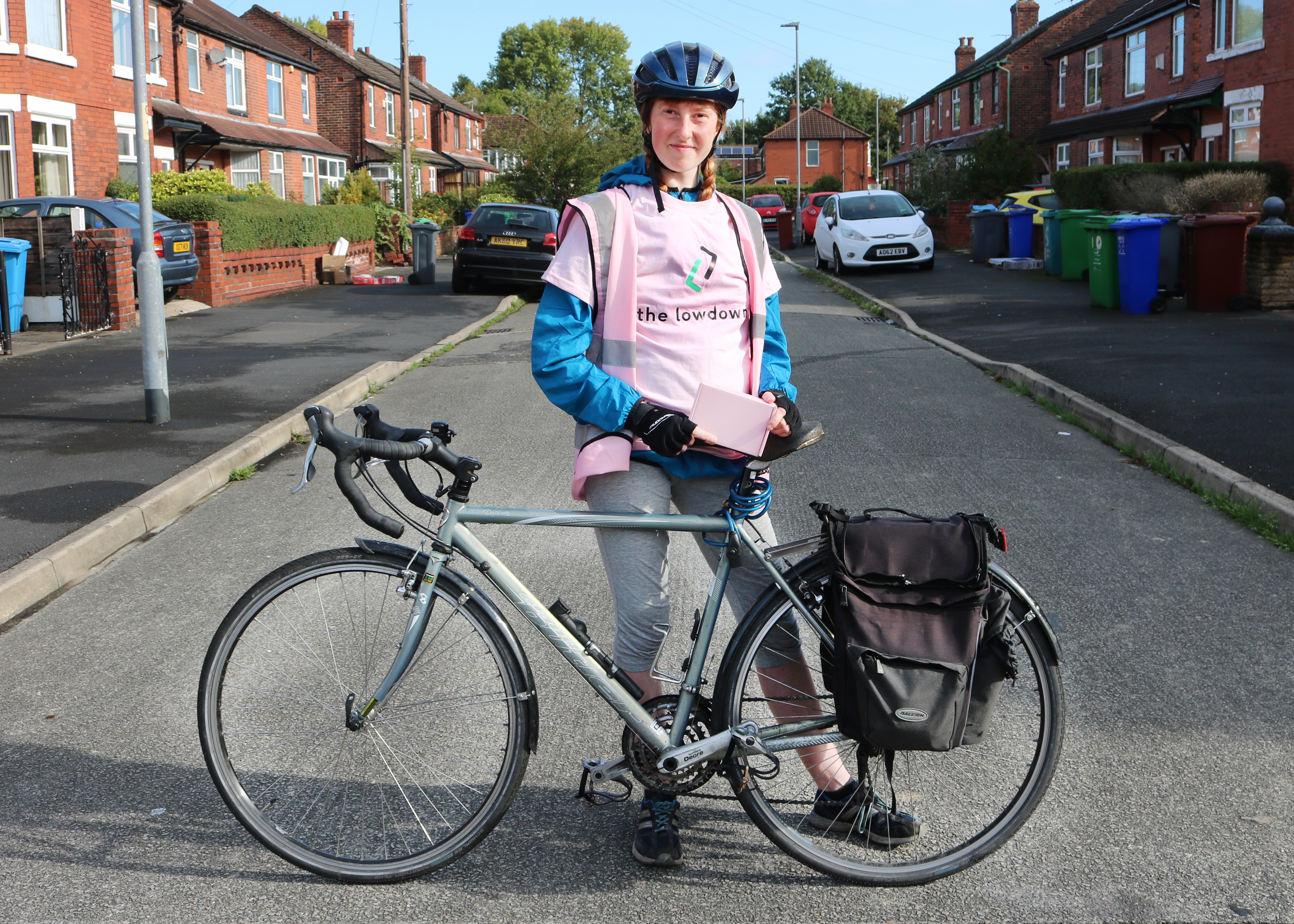 Delivery driver from The Lowdown on a bike