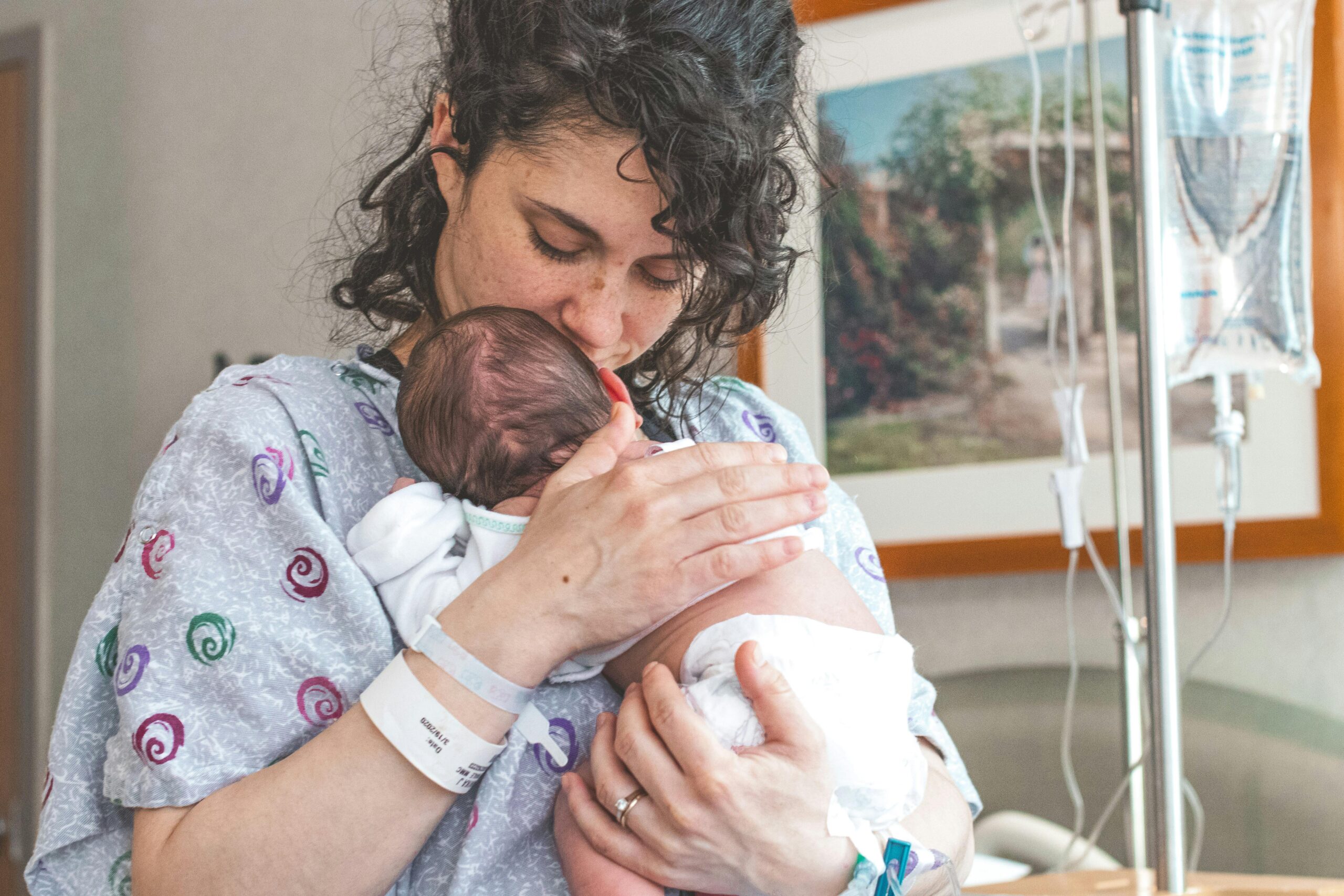 mother holding baby postpartum