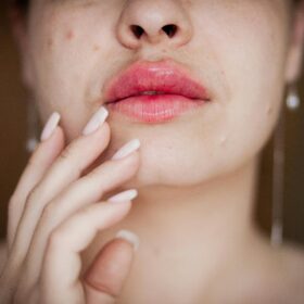 Woman resting hand on chin