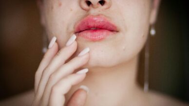 Woman resting hand on chin