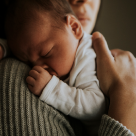 Image of small baby on mum's shoulder