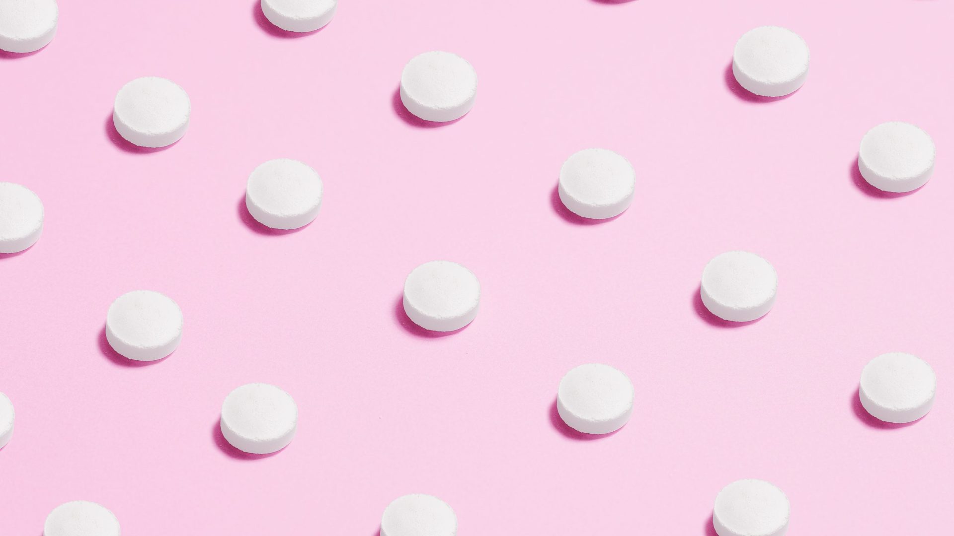 Pills on a pink background
